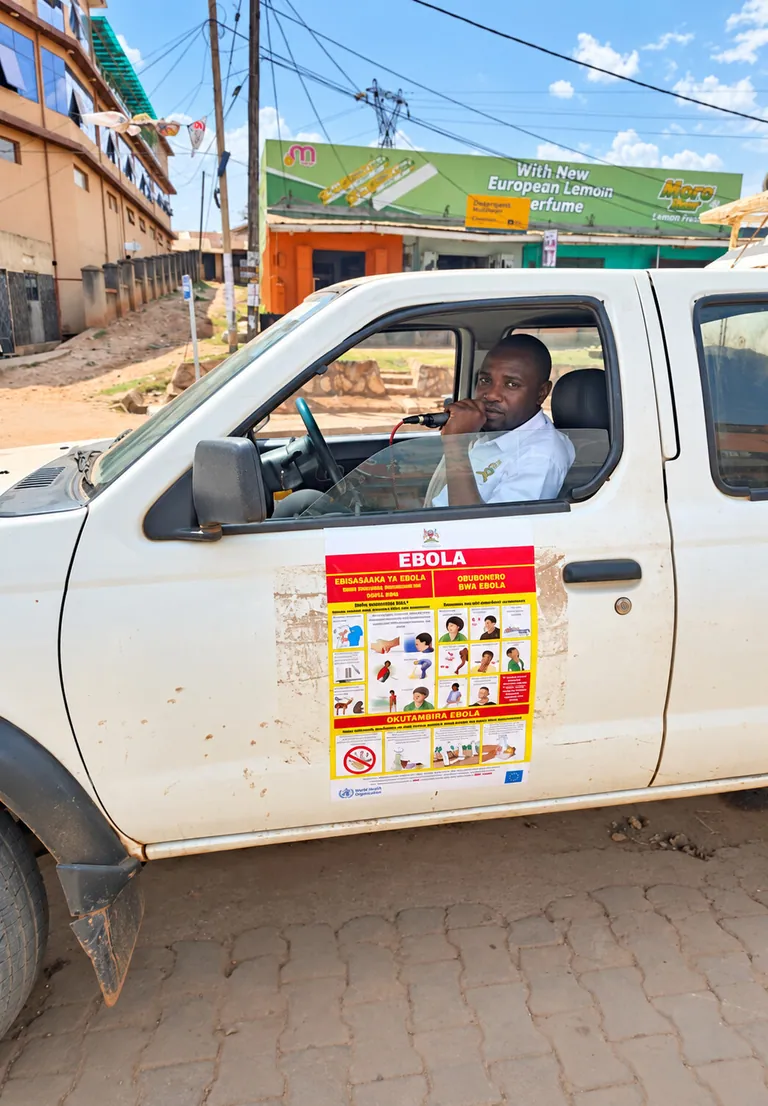 Outreach vehicle displaying an Ebola awareness poster